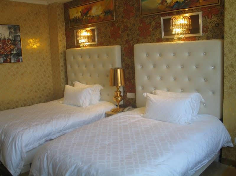 Kapok Hotel تشوهاى المظهر الخارجي الصورة